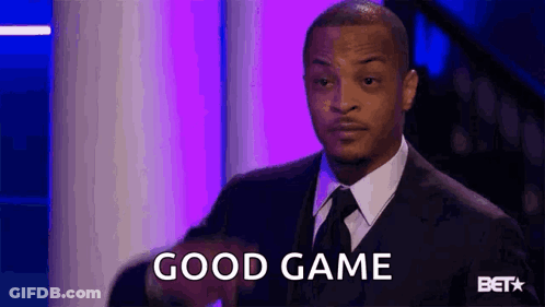 Man In Suit And Tie Saying Good Game Holding Football GIF
