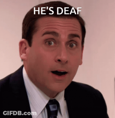 Man In Suit And Tie Saying He's Deaf GIF