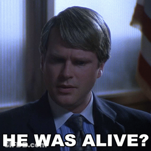 Man In Suit And Tie Saying He Was Alive GIF