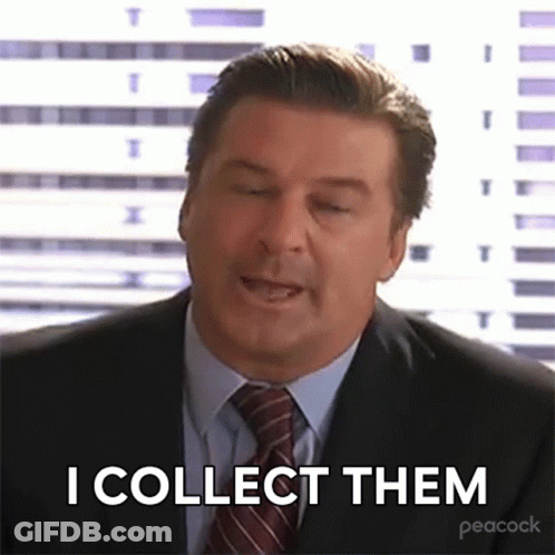 Man In Suit And Tie Saying I Collect Them GIF