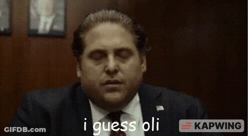 Man In Suit And Tie Saying I Guess Oli GIF