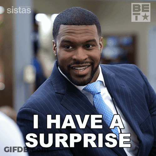 Man In Suit And Tie Saying I Have A Surprise GIF