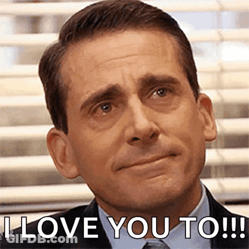Man In Suit And Tie Saying I Love You To GIF