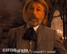 Man In Suit And Tie Saying I'm Sorry I Couldn't Resist GIF