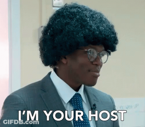 Man In Suit And Tie Saying I'm Your Host GIF