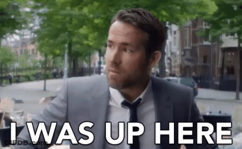 Man In Suit And Tie Saying I Was Up Here GIF