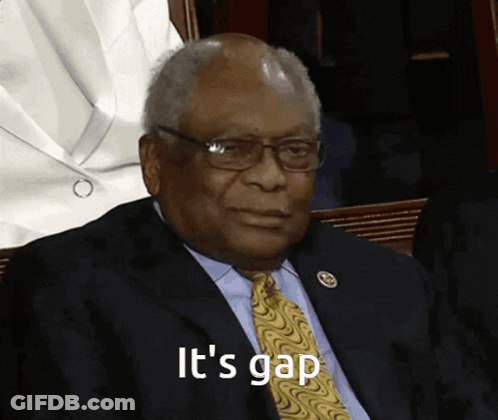 Man In Suit And Tie Saying It's Gap With Glasses GIF
