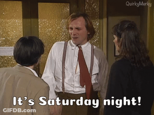 Man In Suit And Tie Saying It's Saturday Night To Two People GIF