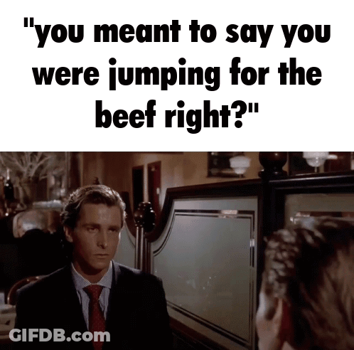 Man In Suit And Tie Saying Jumping For Beef GIF