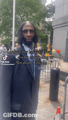 Man In Suit And Tie Saying Look At My Lawyer Dawg He Snoop Dog Or Abraham Lincoln GIF