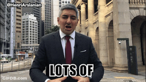 Man In Suit And Tie Saying Lots Of GIF