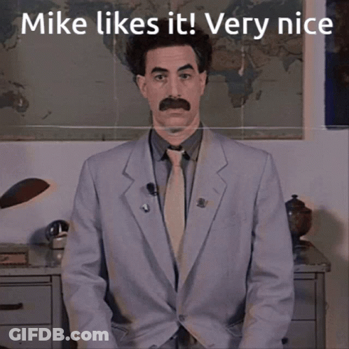 Man In Suit And Tie Saying Mike Likes It Very Nice GIF