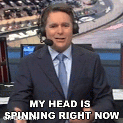 Man In Suit And Tie Saying My Head Is Spinning GIF
