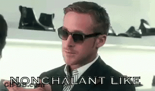 Man In Suit And Tie Saying Nonchalant Like With Sunglasses GIF