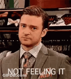Man In Suit And Tie Saying Not Feeling It GIF