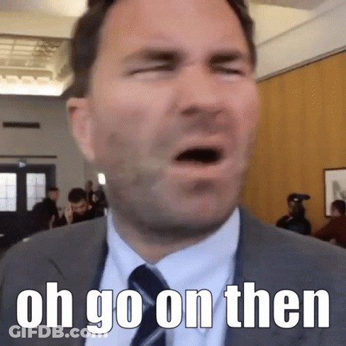Man In Suit And Tie Saying Oh Go On Then GIF