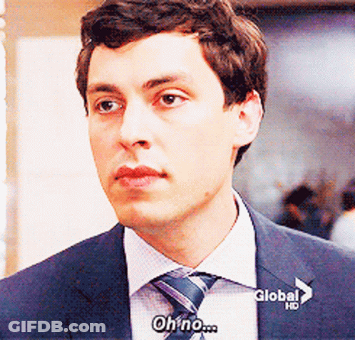 Man In Suit And Tie Saying Oh No Global GIF