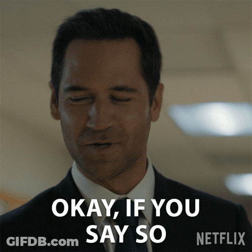 Man In Suit And Tie Saying Okay GIF
