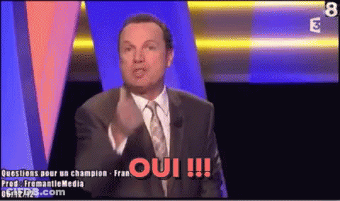 Man In Suit And Tie Saying Oui GIF