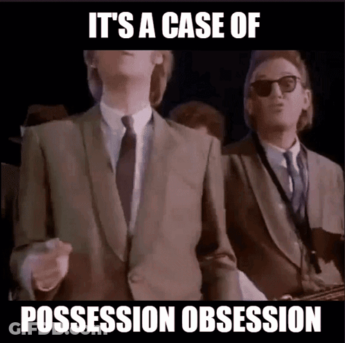 Man In Suit And Tie Saying Possession Obsession GIF