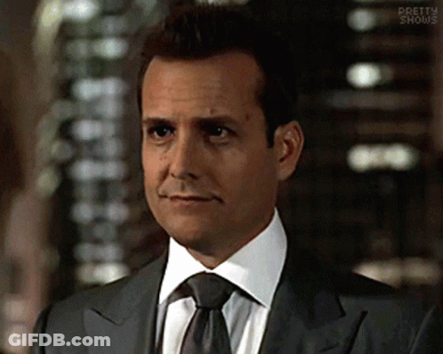 Man In Suit And Tie Saying Pretty Shows GIF