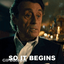 Man In Suit And Tie Saying So It Begins GIF