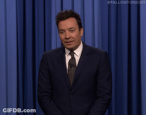 Man In Suit And Tie Saying Sup GIF
