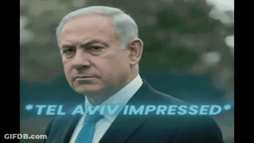 Man In Suit And Tie Saying Tel Aviv Impressed GIF