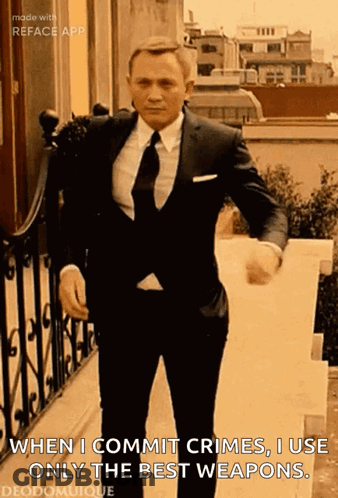 Man In Suit And Tie Saying When I Commit Crimes I Use Only The Best Weapons GIF