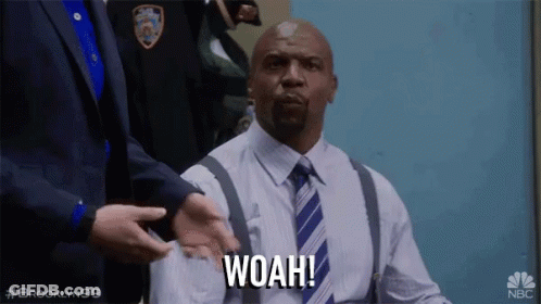 Man In Suit And Tie Saying Woah GIF