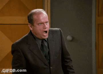 Man In Suit And Tie Saying Wounded GIF