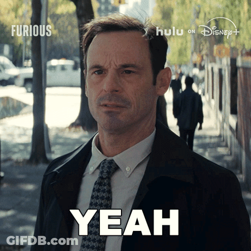 Man In Suit And Tie Saying Yeah GIF