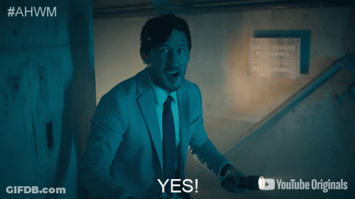 Man In Suit And Tie Saying Yes GIF