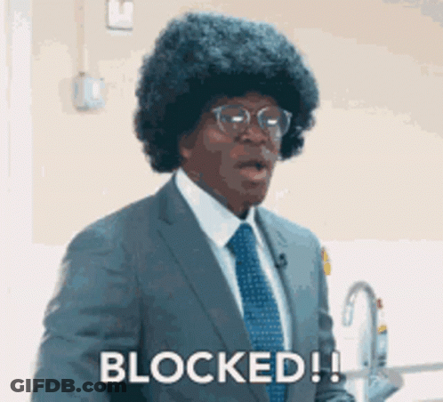 Man In Suit And Tie Says Blocked GIF