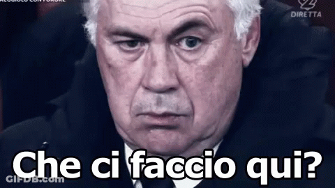 Man In Suit And Tie Says Che Ci Faccio Qui GIF