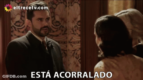 Man In Suit And Tie Says Esta Acorrolado GIF
