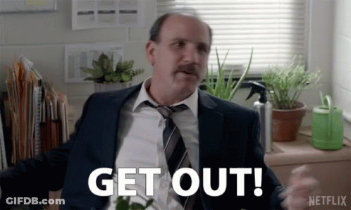 Man In Suit And Tie Says Get Out Netflix Ad GIF