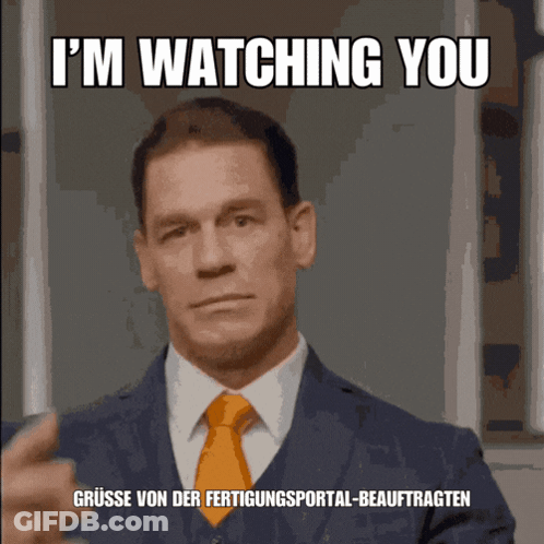 Man In Suit And Tie Says I'm Watching You In German GIF