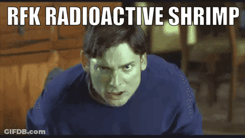 Man In Suit And Tie Says Im Front Of American Flag GIF