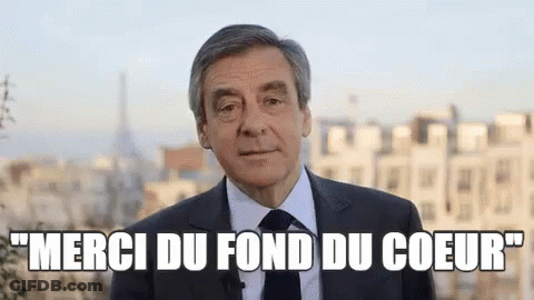 Man In Suit And Tie Says Merci Du Fond Du Coeur GIF