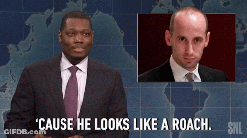 Man In Suit And Tie Says Roach GIF
