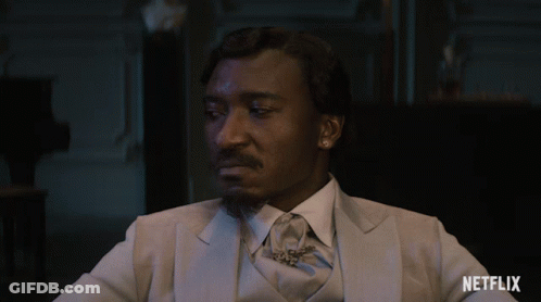 Man In Suit And Tie Says Scram GIF