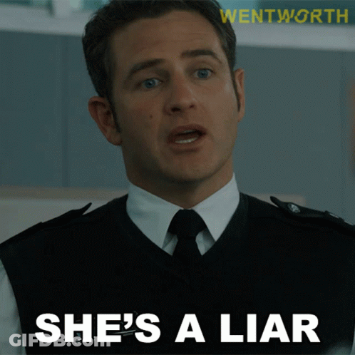 Man In Suit And Tie Says She Is A Liar GIF
