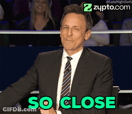 Man In Suit And Tie Says So Close In Green GIF