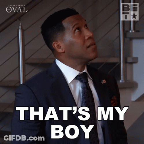 Man In Suit And Tie Says That's My Boy GIF