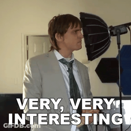 Man In Suit And Tie Says Very Very Interesting GIF