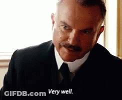 Man In Suit And Tie Says Very Well GIF