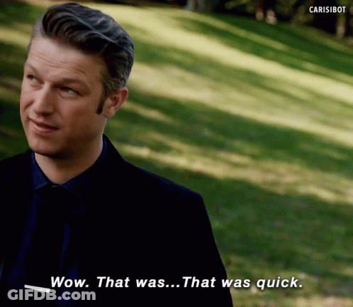 Man In Suit And Tie Says Wow GIF