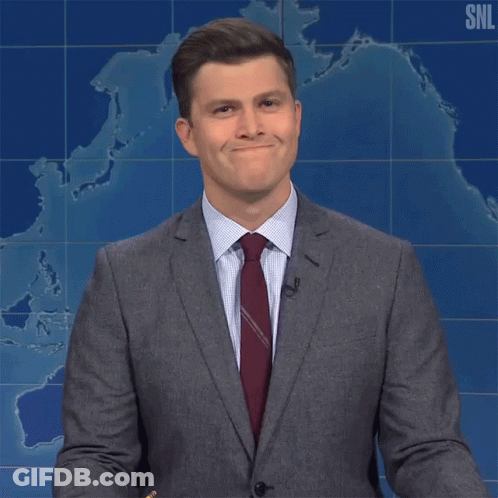 Man In Suit And Tie Says Yeah In Front Of SNL Map GIF