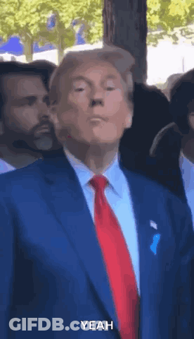 Man In Suit And Tie Says Yeah To Crowd GIF